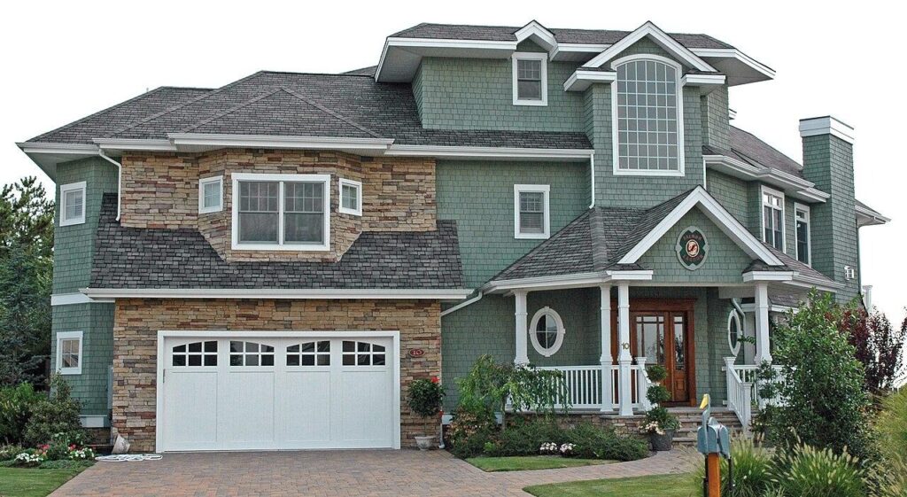 An asphalt shingle roof on a two-story home